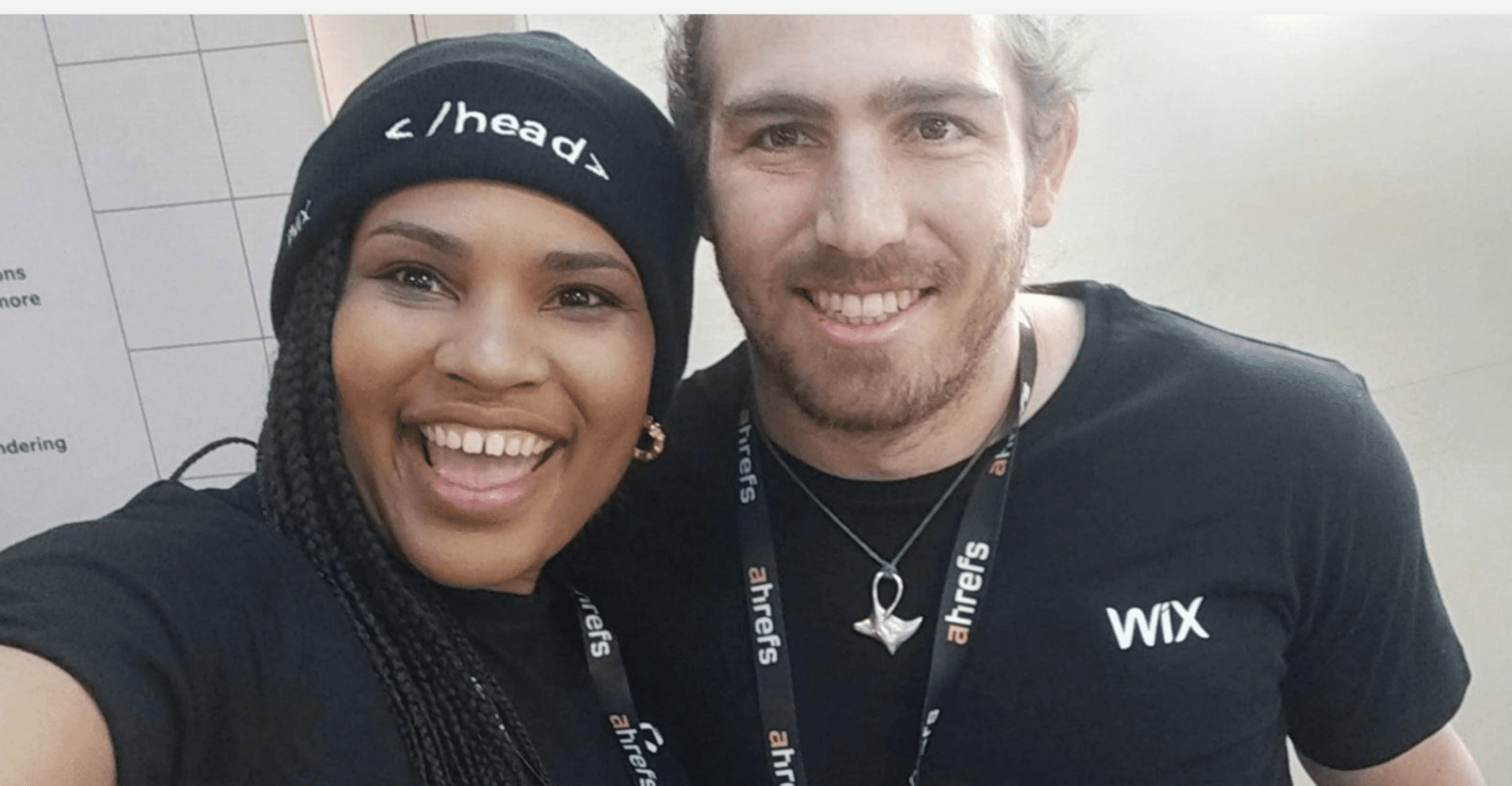 The same photo of two people with the brand name reading correctly.